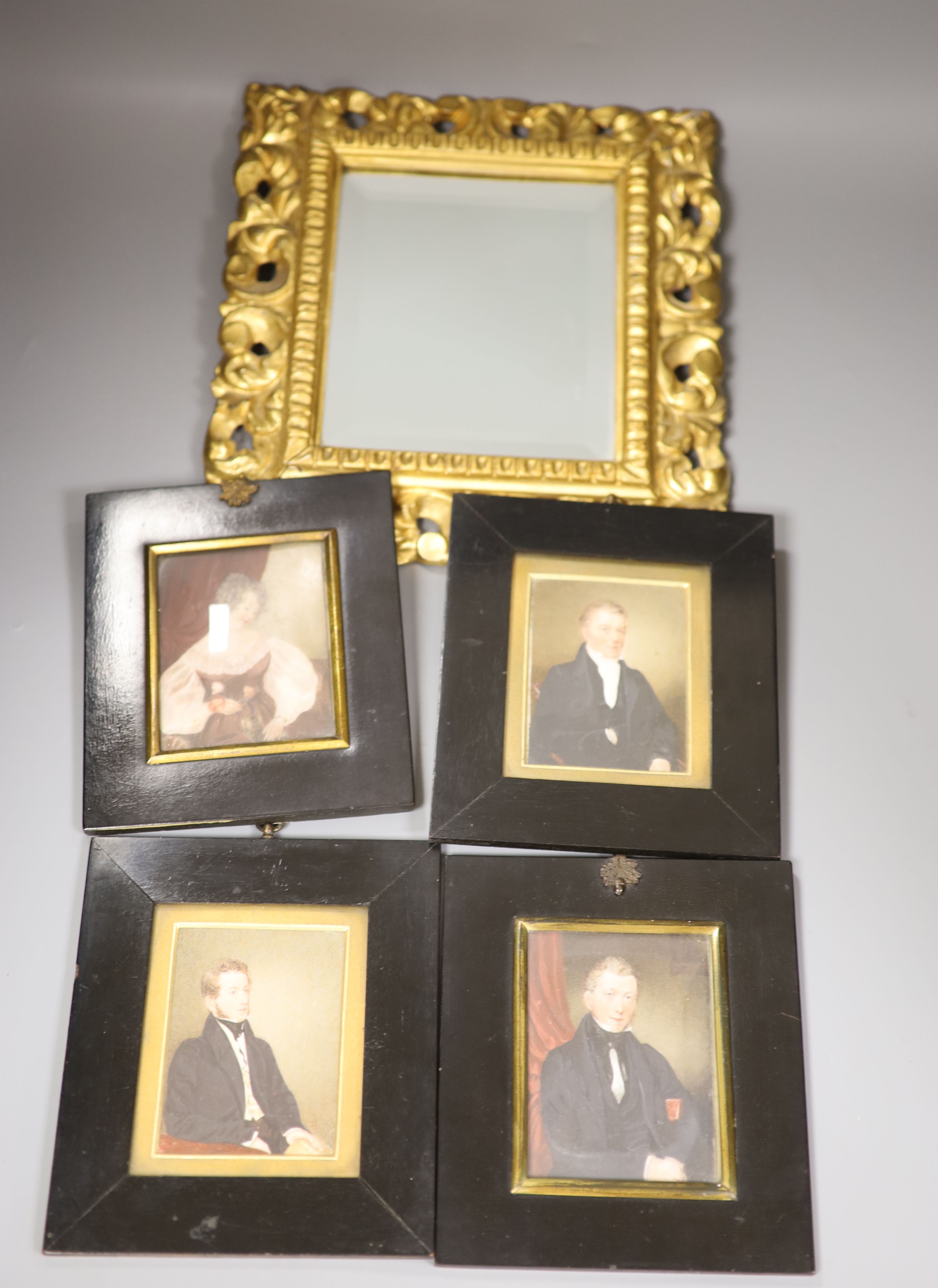 Four 19th century miniature portraits and a gilt-framed mirror, 26 x 29cm